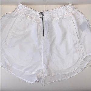 LF white flowy shorts.